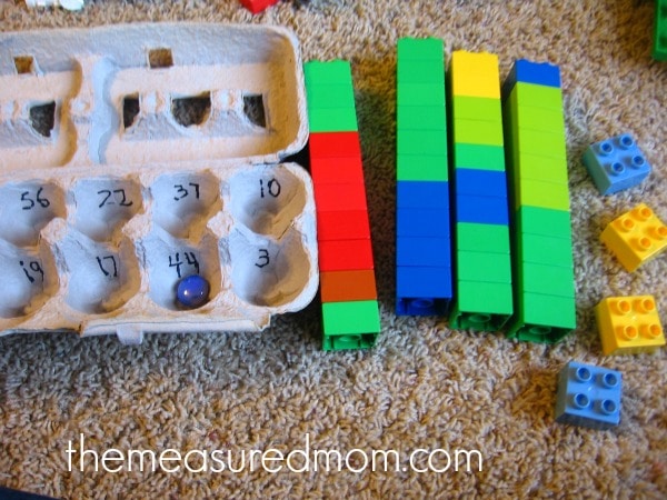 child practicing counting with blocks