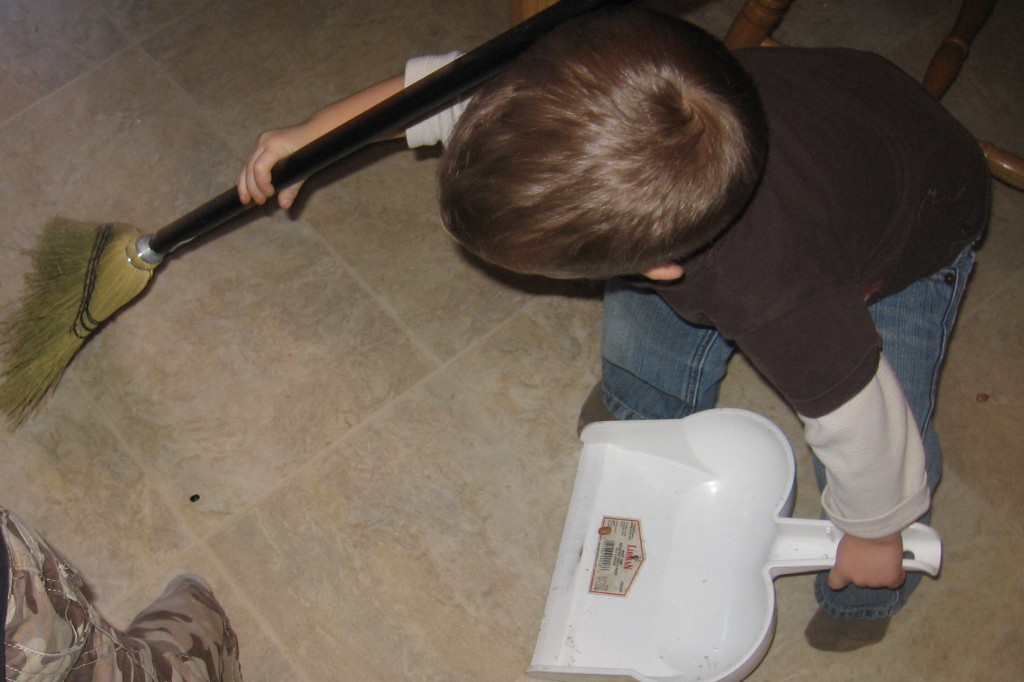 child sweeping