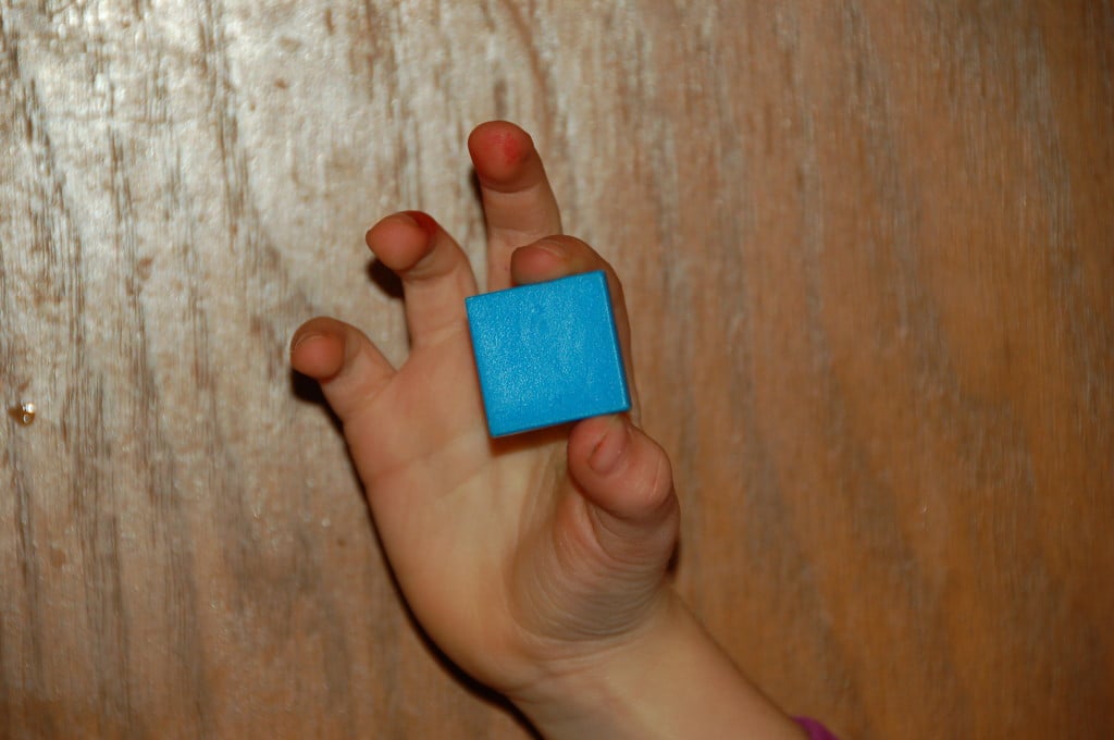 child holding tile