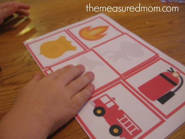 child matching firefighting shapes and shadows