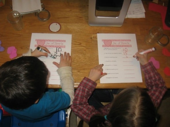 children writing on letter H jar of hearts worksheet 