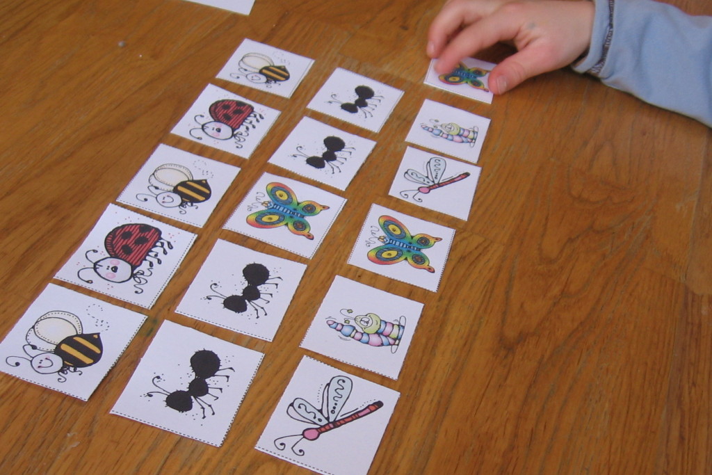 child placing insect pattern on table