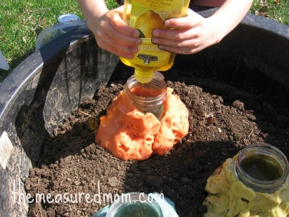 squeezing dish washer soap into jar