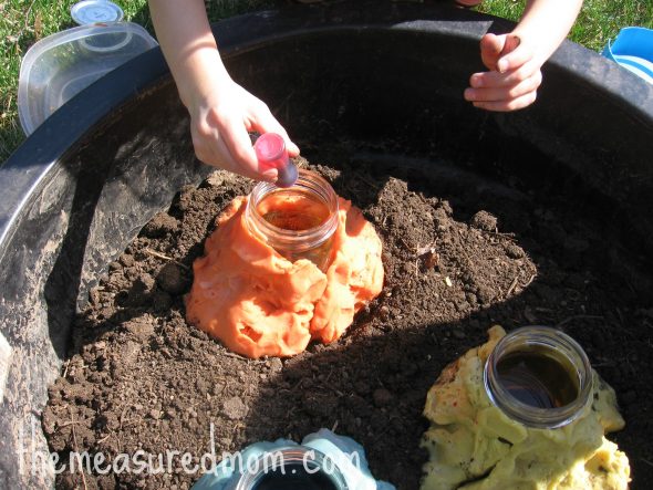 adding food coloring to jar