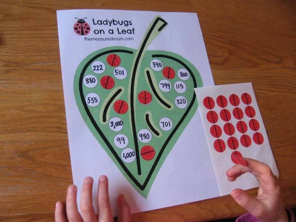 child with stickers and clip art of leaf