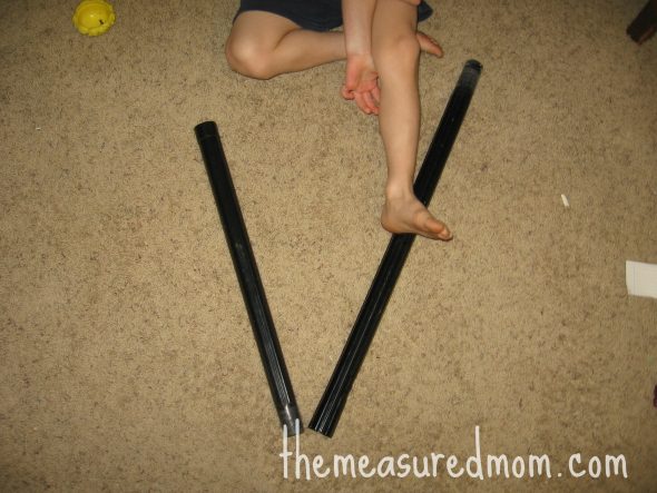 child with V made out of vacuum parts