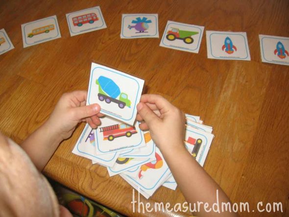 child playing matching transportation memory game