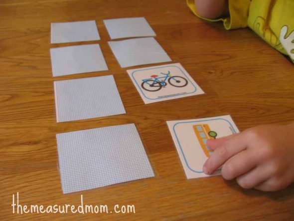 child playing matching transportation memory game