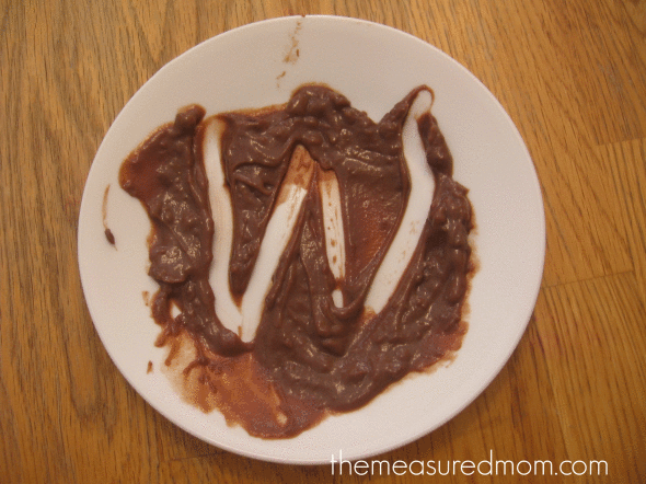 letter W written in chocolate pudding