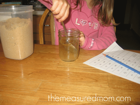 child doing science activity will it dissolve in water