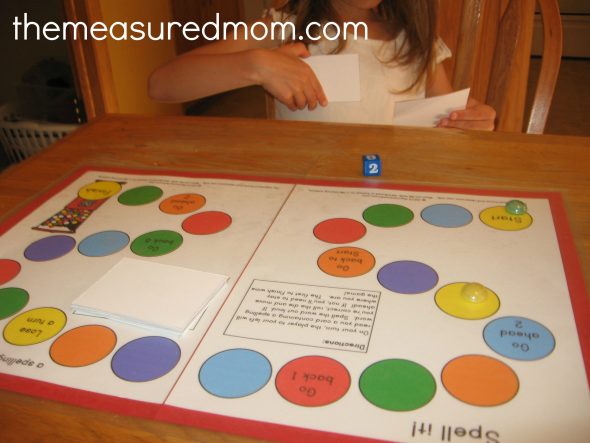 child playing printable spelling game