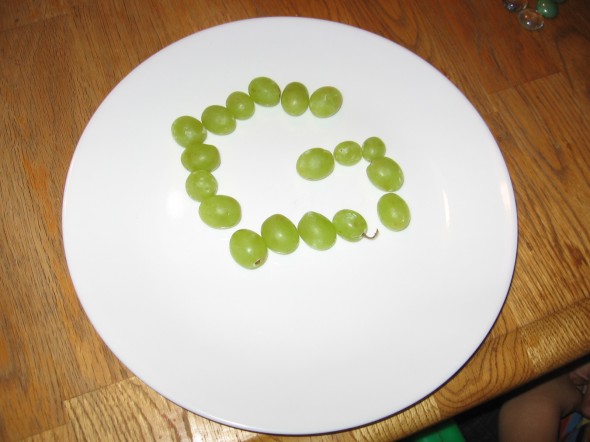 make letter G with grapes