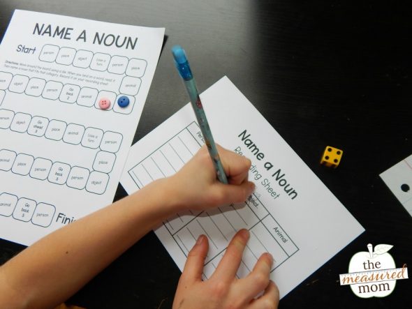 child playing a printable noun game