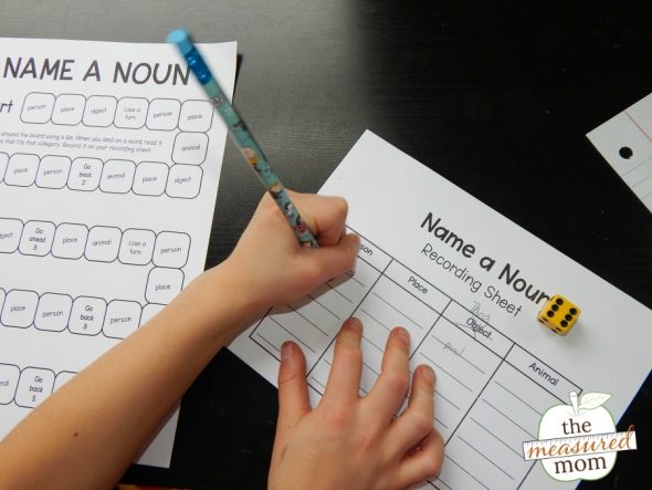 child playing a printable noun game