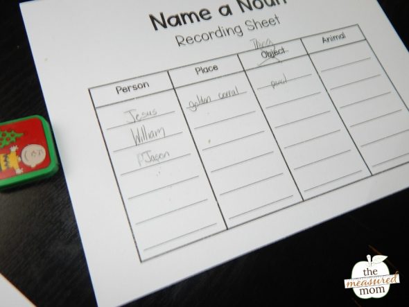 child playing a printable noun game