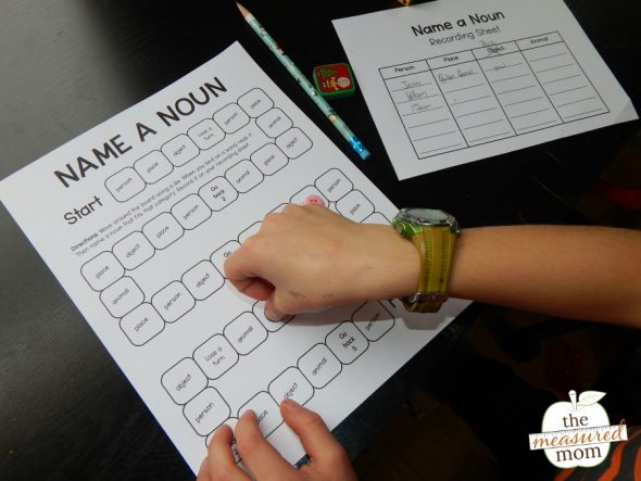 child playing a printable noun game