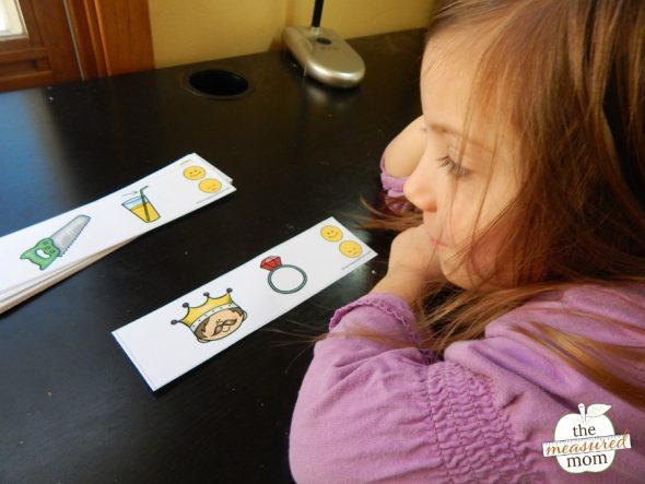 Child practicing rhyming with printable