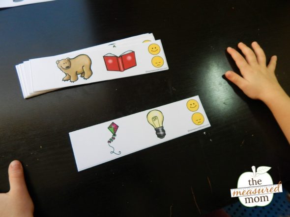 Child practicing rhyming with printable