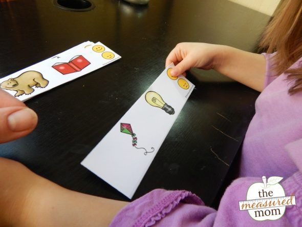 Child practicing rhyming with printable