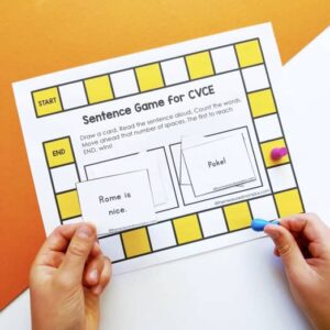 Child playing a sentence game for CVCE words